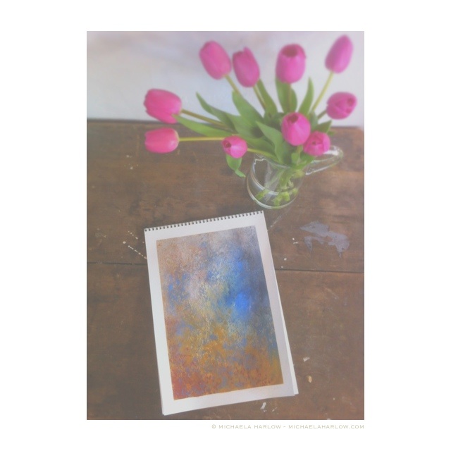 ostre-Lache-2014-with-tulips-on-studio-desk-–-Michaela-Harlow-–-11″-x-9″-pastel-on-paper-15″-x-11″.jpg